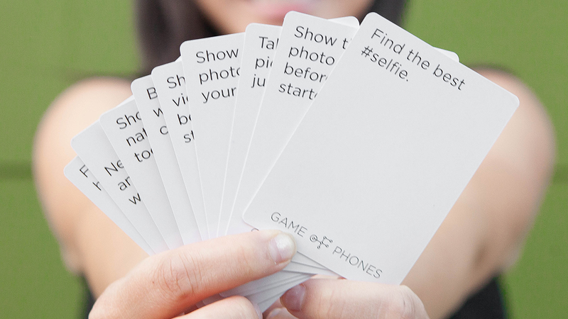 Illustration for article titled A Card Game That Requires You To Keep Your Phone Out Is Genius